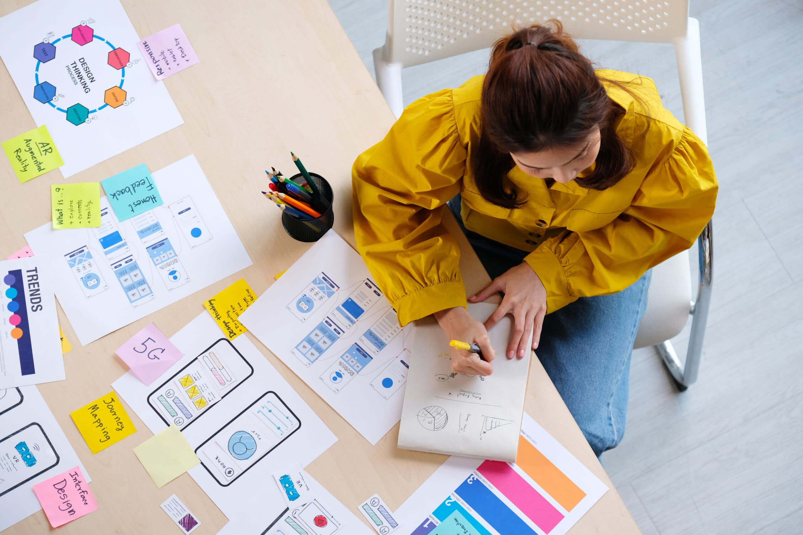 A designer working through sketches and colour