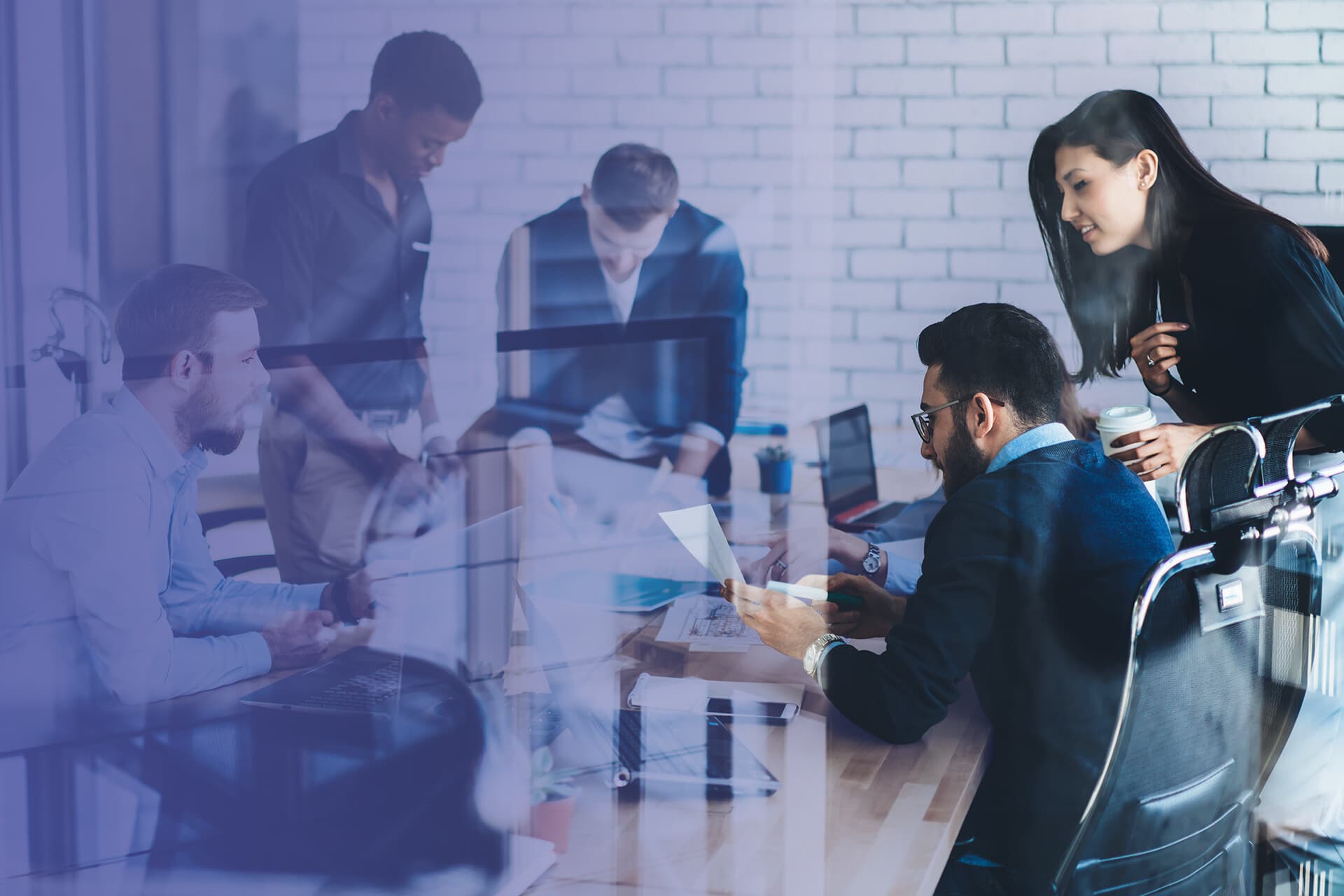 A technology team at work across screens