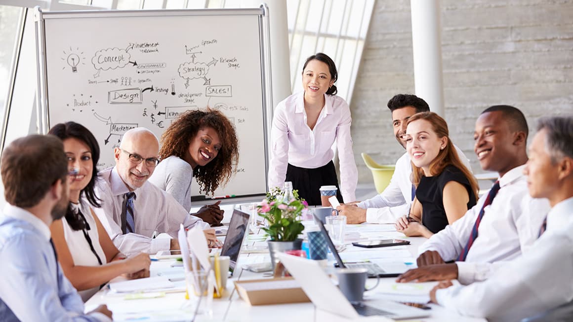A full team working together around one table
